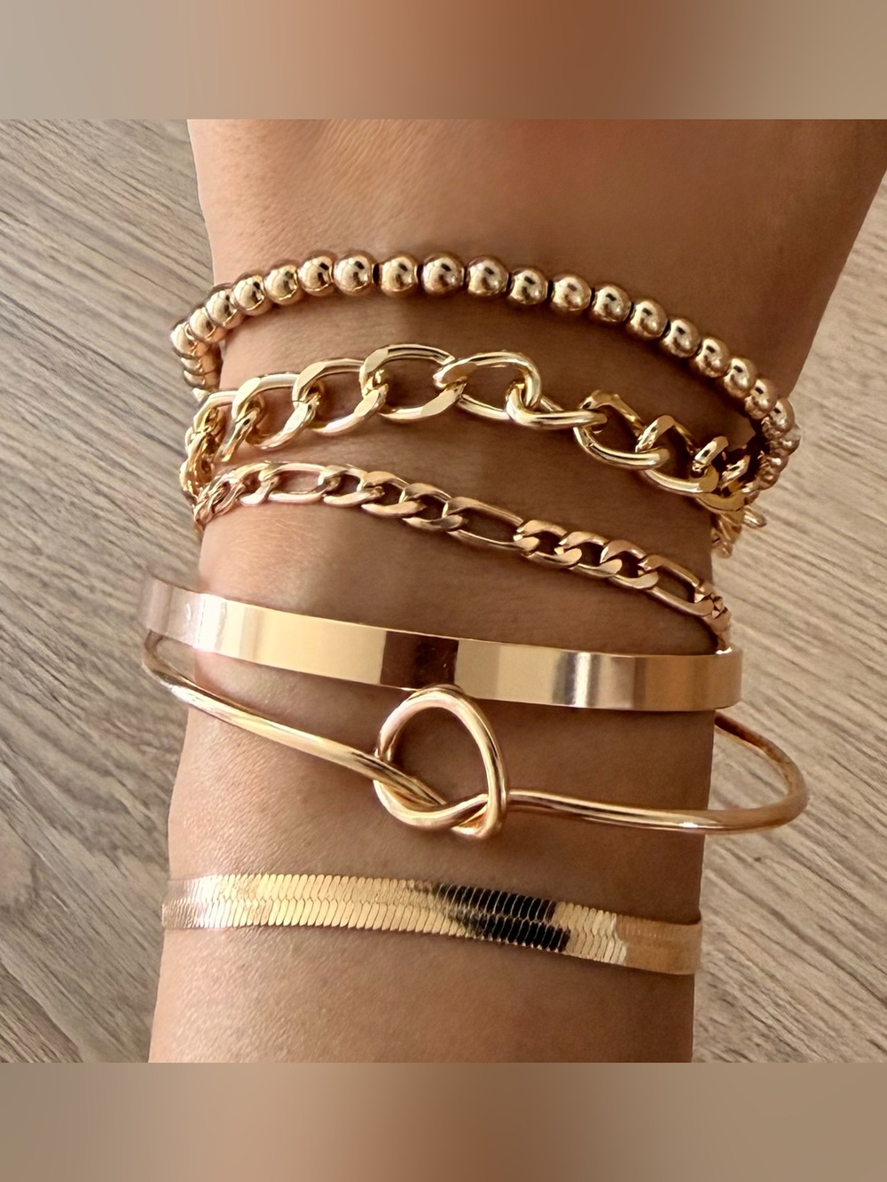 Gold colored fashion bracelets set